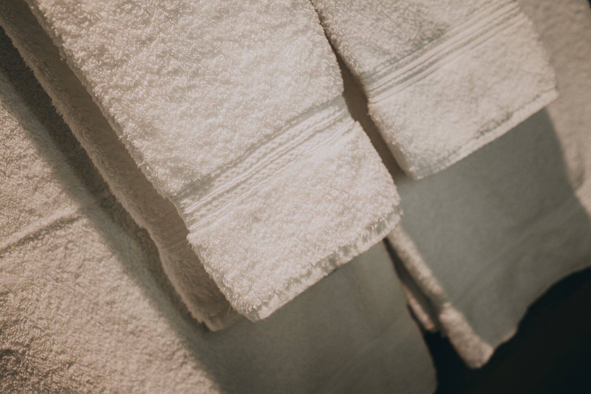 A close-up of stacked towels with a textured surface.