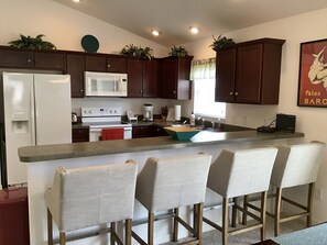 Fridge, microwave, oven, stovetop - Charming 3BR Home in The Villages: Your Florida Retreat Awaits! (The Villages)