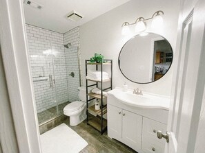 Shower, hair dryer, towels, soap