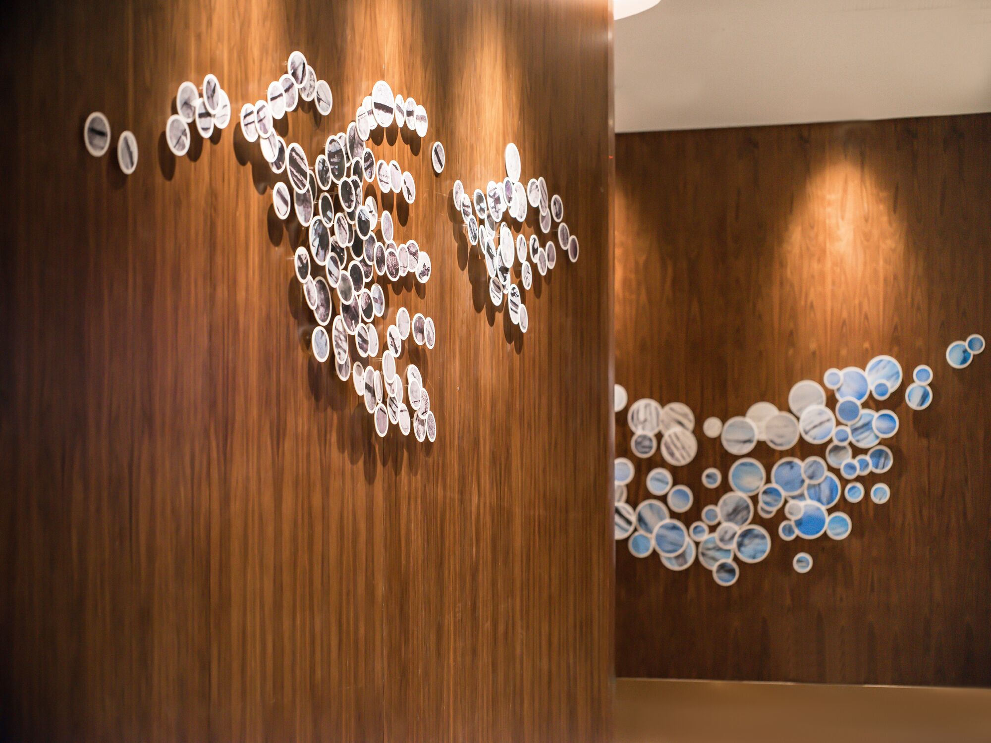 A wooden wall with circular patterns.