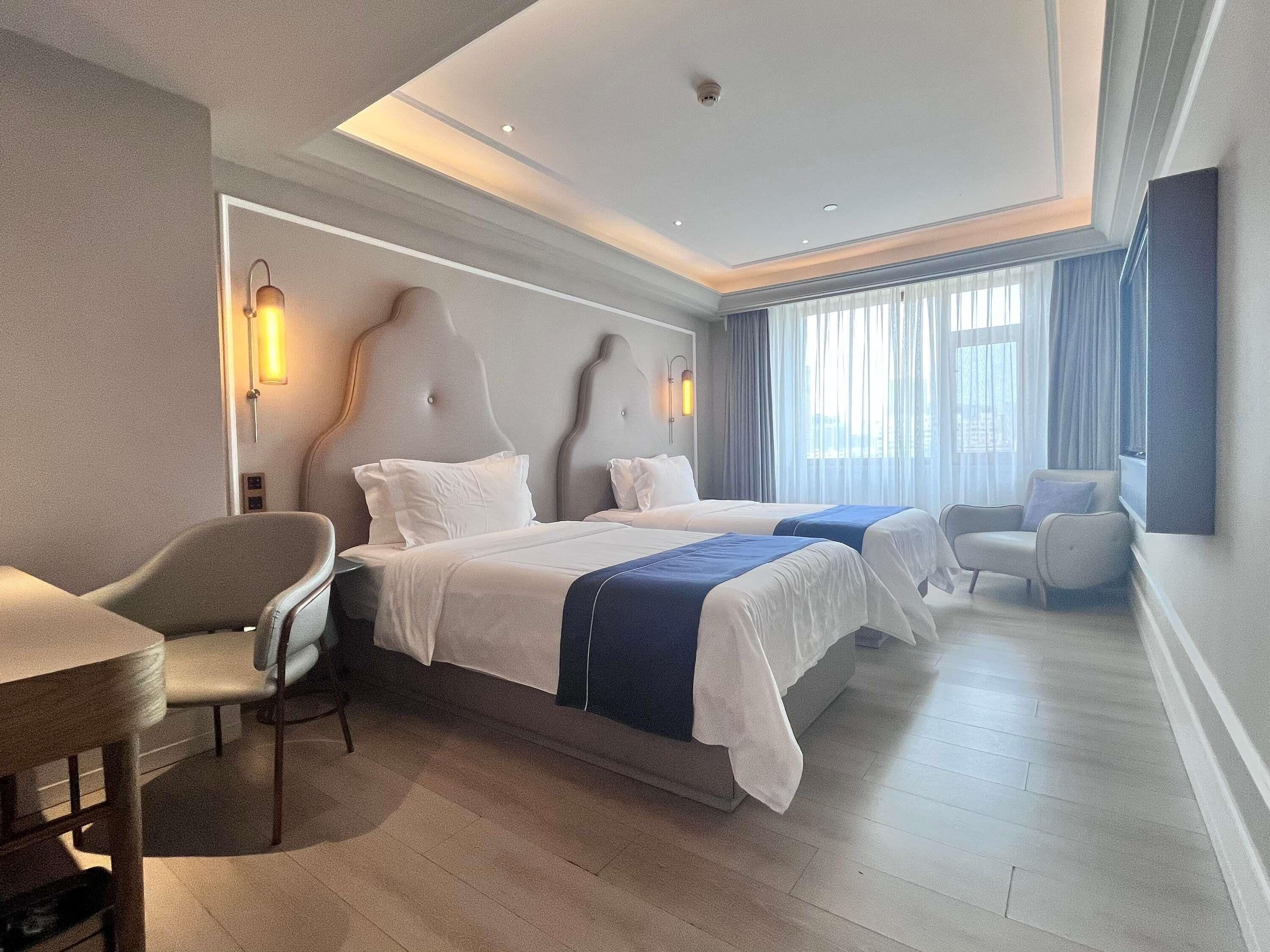 Deluxe Room, 2 Twin Beds | Down comforters, in-room safe, desk, free WiFi