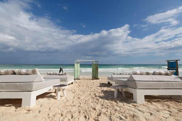 On the beach, sun loungers, beach towels