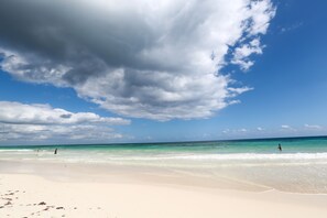 On the beach, sun loungers, beach towels