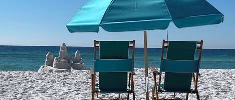 On the beach, sun-loungers
