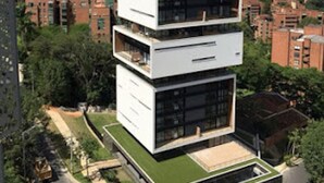 A modern multi-story building with a unique stacked design, featuring balconies and large windows. - ★18th Floor★Coolest building in Medellin★RoofTop Pool/Jacuzzi/Gym★Amazing Views★ (Medellin)