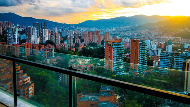 A cityscape with high-rise buildings and mountains in the background. - ★18th Floor★Coolest building in Medellin★RoofTop Pool/Jacuzzi/Gym★Amazing Views★ (Medellin)
