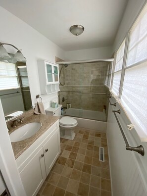 Combined shower/tub, hair dryer, towels, toilet paper