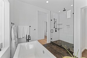 Combined shower/tub, hair dryer, bidet, towels - @HouseonGlacier - Modern Ski-in, Ski-Out Chalet with Private Hot Tub & View (Whitefish)