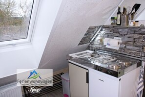 Fridge, microwave, stovetop, coffee/tea maker