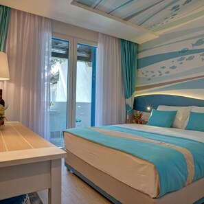 A bedroom with a bed, a desk, and a view of the outdoors. - Hotel Aleksandar (Budva)