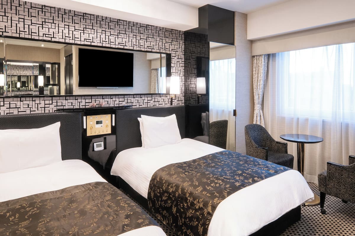 Deluxe Twin Room, Non Smoking | Down comforters, desk, blackout drapes, iron/ironing board