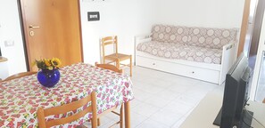 Apartment | Living area | 21-inch flat-screen TV with digital channels, TV