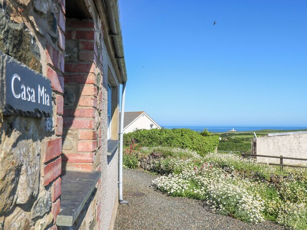 Enjoy a serene ocean view from Casa Mia's tranquil setting.