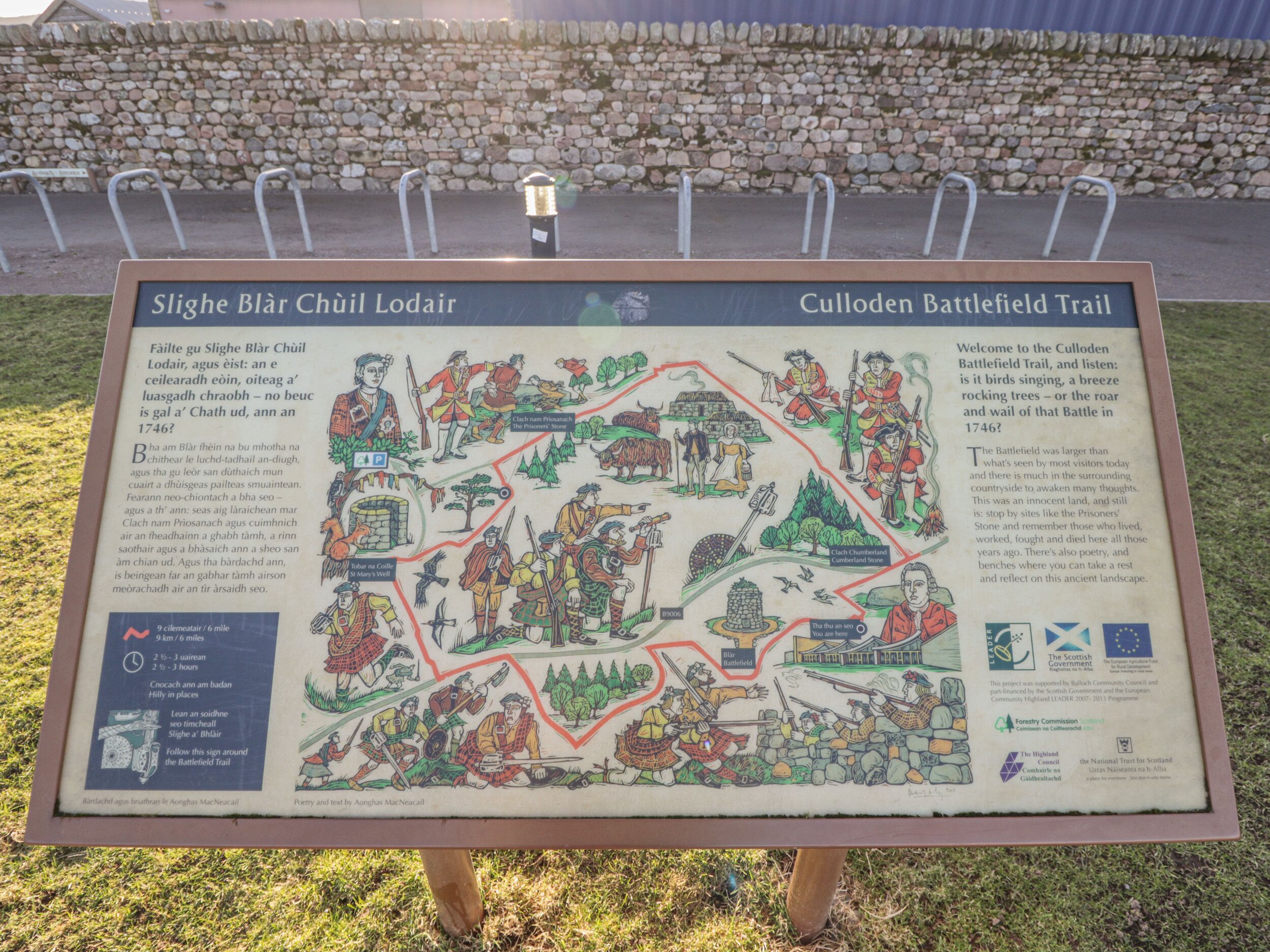 A historical marker detailing Culloden Battlefield Trail with illustrations of historical events and figures.
