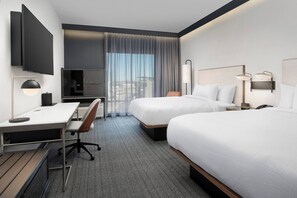 Premium bedding, desk, laptop workspace, iron/ironing board