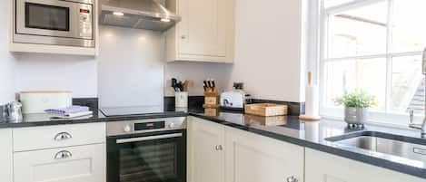 Fridge, electric kettle, toaster, cookware/dishes/utensils