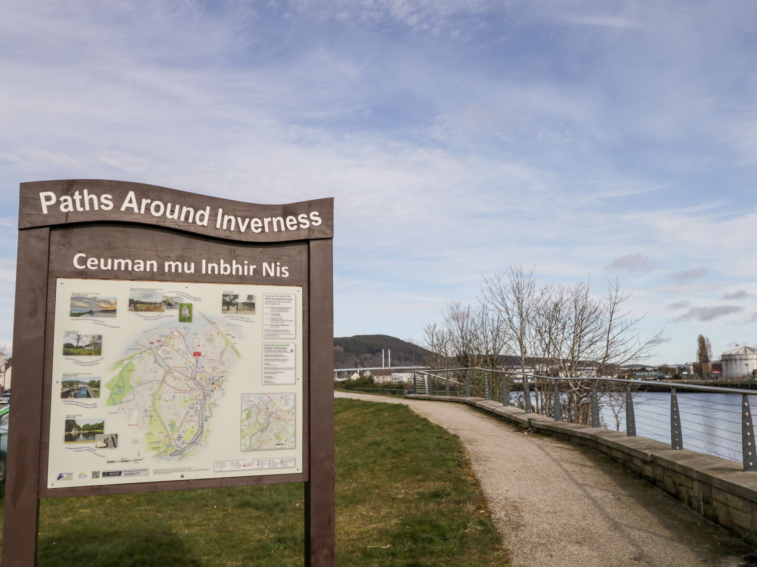 A signboard titled 'Paths Around Inverness' with a map and information.
