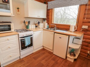 Fridge, electric kettle, cookware/dishes/utensils