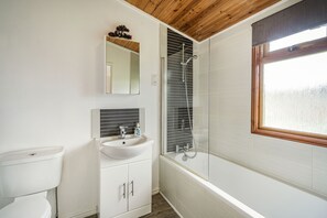 A bathroom with a toilet, sink, and shower. - Lakeview Lodge (Carnforth)