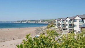 A coastal hotel with multiple balconies overlooking the beach and sea. - 17 Burgh Island Causeway (Kingsbridge)
