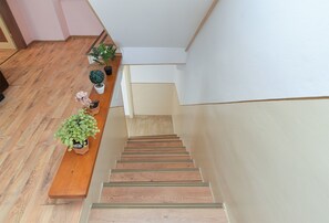 A wooden staircase with a bench on the left, leading to a landing. - House 2063/32559 (Istria - Poreč), 6000m from the beach (Poreč)