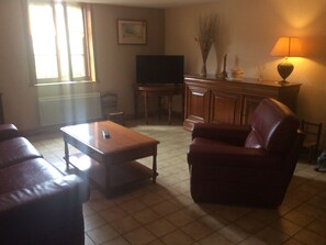 TV, fireplace, table football - Village Home with Game Room and Nature Nearby (Bazien)