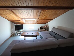 TV, fireplace - Charming Cottage with Fireplace, Terrace, and Baby Amenities near Bourbonne-les-Bains (Isches)