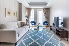 TV - Modern Luxury Living in This 3BR Apt in Downtown Dubai (Dubai)