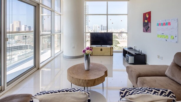 Living room - Premier 2BR Apartment in JVC Community - Sleeps 5! (Dubai)