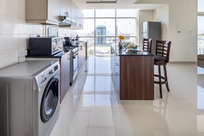 Microwave, oven, stovetop, dishwasher - Premier 2BR Apartment in JVC Community - Sleeps 5! (Dubai)