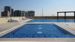 Pool - Premier 2BR Apartment in JVC Community - Sleeps 5! (Dubai)