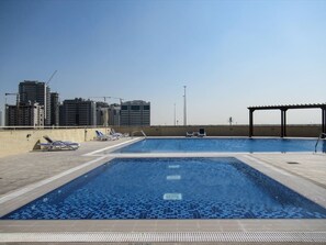 Outdoor pool - Premier 2BR Apartment in JVC Community - Sleeps 5! (Dubai)