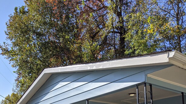 A small, single-story building with a covered porch and a small window. - Clean, full kitchen, stand alone cabin adjoining Lake Barkley State Park (Cadiz)