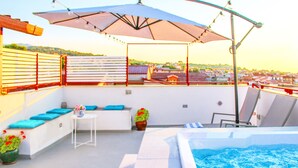 A rooftop terrace with a pool, seating area, and a view of the city. - Duke of Aosta Terrace with private mini-pool (Acquedolci)