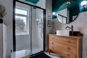 Shower, rainfall showerhead, hair dryer, towels