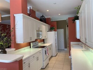 Fridge, microwave, oven, stovetop - Private home heated pool and spa in a quiet  gated community  Vanderbilt Beach.  (Naples)