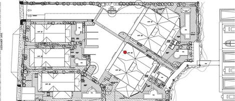 A floor plan of a hotel with multiple units, pools, and landscaped areas.