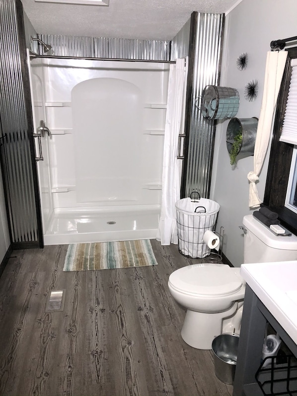 Combined shower/tub, hair dryer, towels, soap