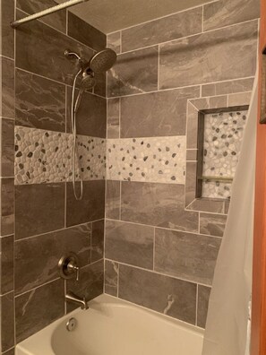 Combined shower/tub, hair dryer, towels, soap