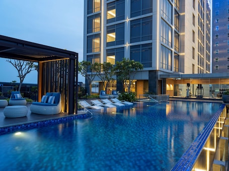 Outdoor pool, open 6:00 AM to 10:00 PM, sun loungers