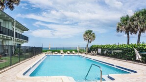 A rectangular swimming pool with a tiled edge, surrounded by a brick deck. - Casa al Mare – Premier "True Beachfront" Living in Vero Beach!  Steps to sand! (Vero Beach)