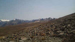 A rocky mountain landscape with snow-capped peaks in the distance. - kopuha Small Batch 
Not available at the moment (Tekapo)