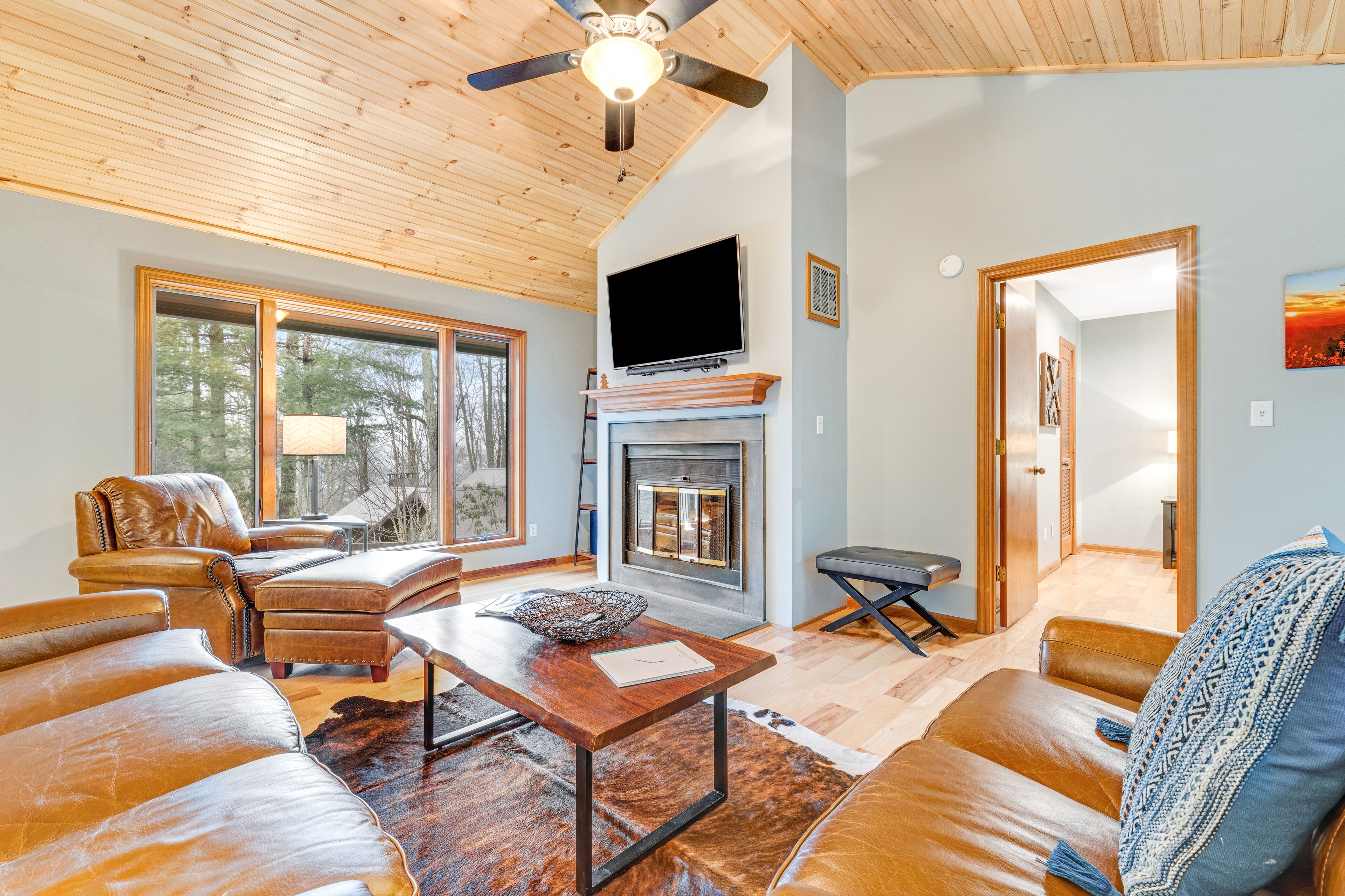 Single-story home in the woods with game room and gas fireplace