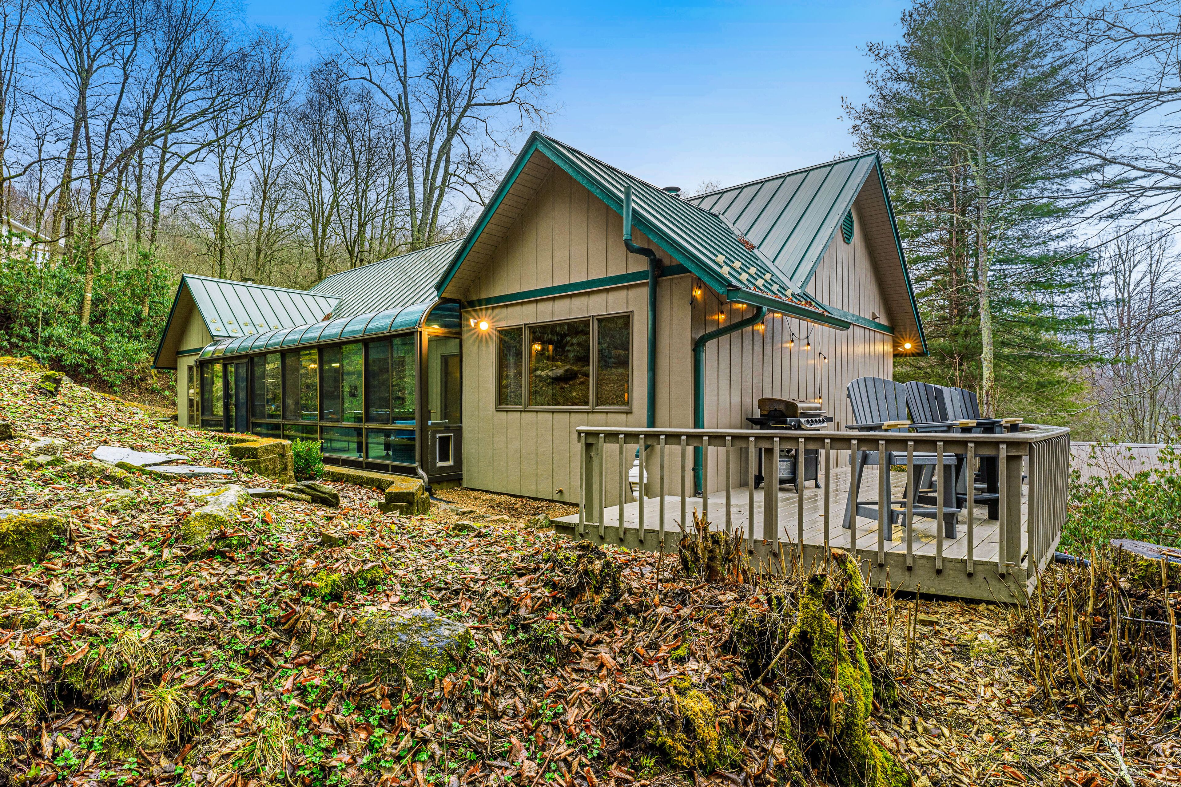 Single-story home in the woods with game room and gas fireplace