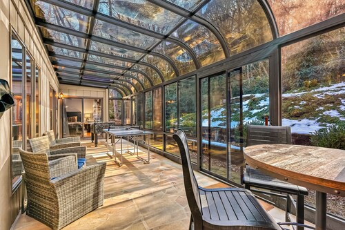 Single-story home in the woods with game room and gas fireplace