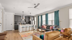 A modern apartment with a kitchen, dining area, and living room. - Duke9 ~ Private Penthouse Rooftop ~ Newly Redesigned Interior ~ 8 Min to Downtown and Broadway (Nashville)
