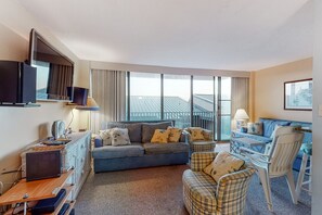 Enjoy a city view from the large window, work or relax in the seating area with a sofa and armchairs.