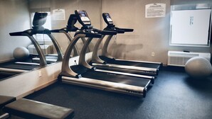A fitness center with treadmills, a bench, and exercise balls. - Baymont Inn & Suites by Wyndham (McAllen)