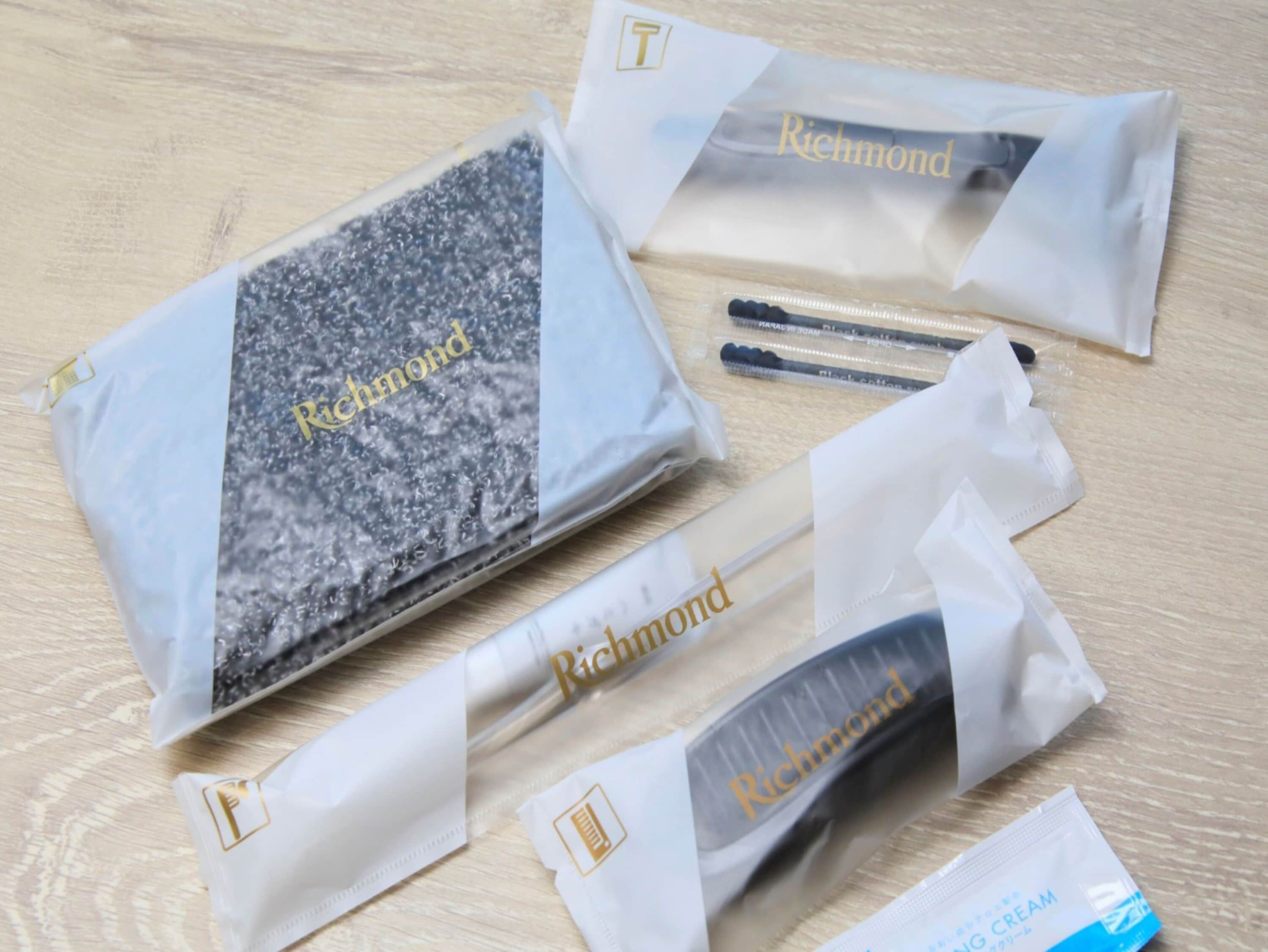 A collection of items with the 'Richmond' brand name visible on them, laid out on a wooden surface.