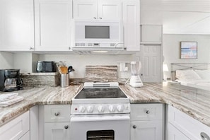 Coffee/tea maker, fridge, microwave, oven - Beachfront Studio at Tropic Terrace #49: Steps to sand, sunsets & Heated Pool (Treasure Island)